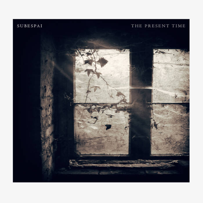 The Present Time by Subespai album cover. The image depicts a dirty window with subtle spider webs.