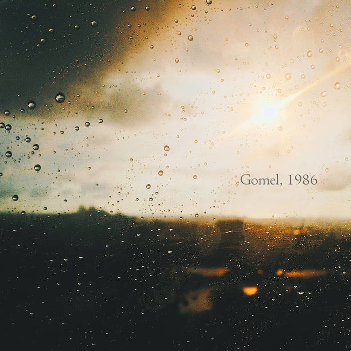 Gomel, 1986 album cover. The image shows a Sunlight streaming through a rain-streaked window, creating a beautiful contrast of light and water droplets.